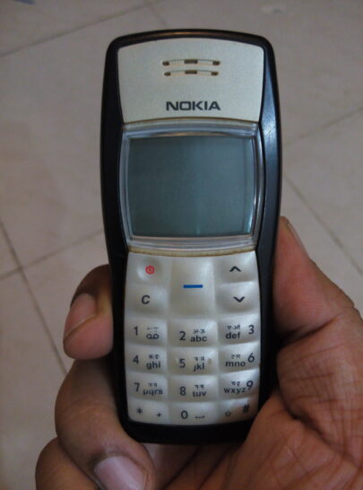 hand holding nokia 1100